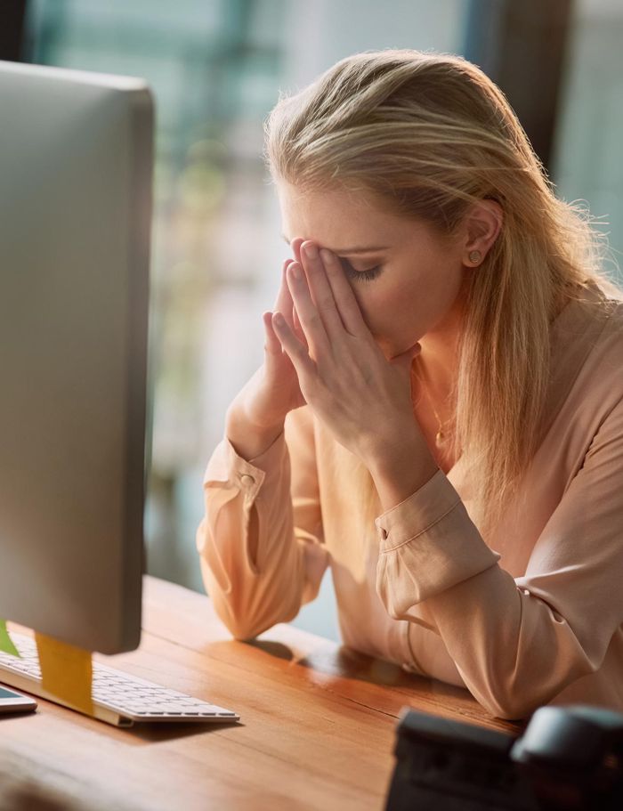 work-is-getting-her-shot-exhausted-young-businesswoman-working-computer-office